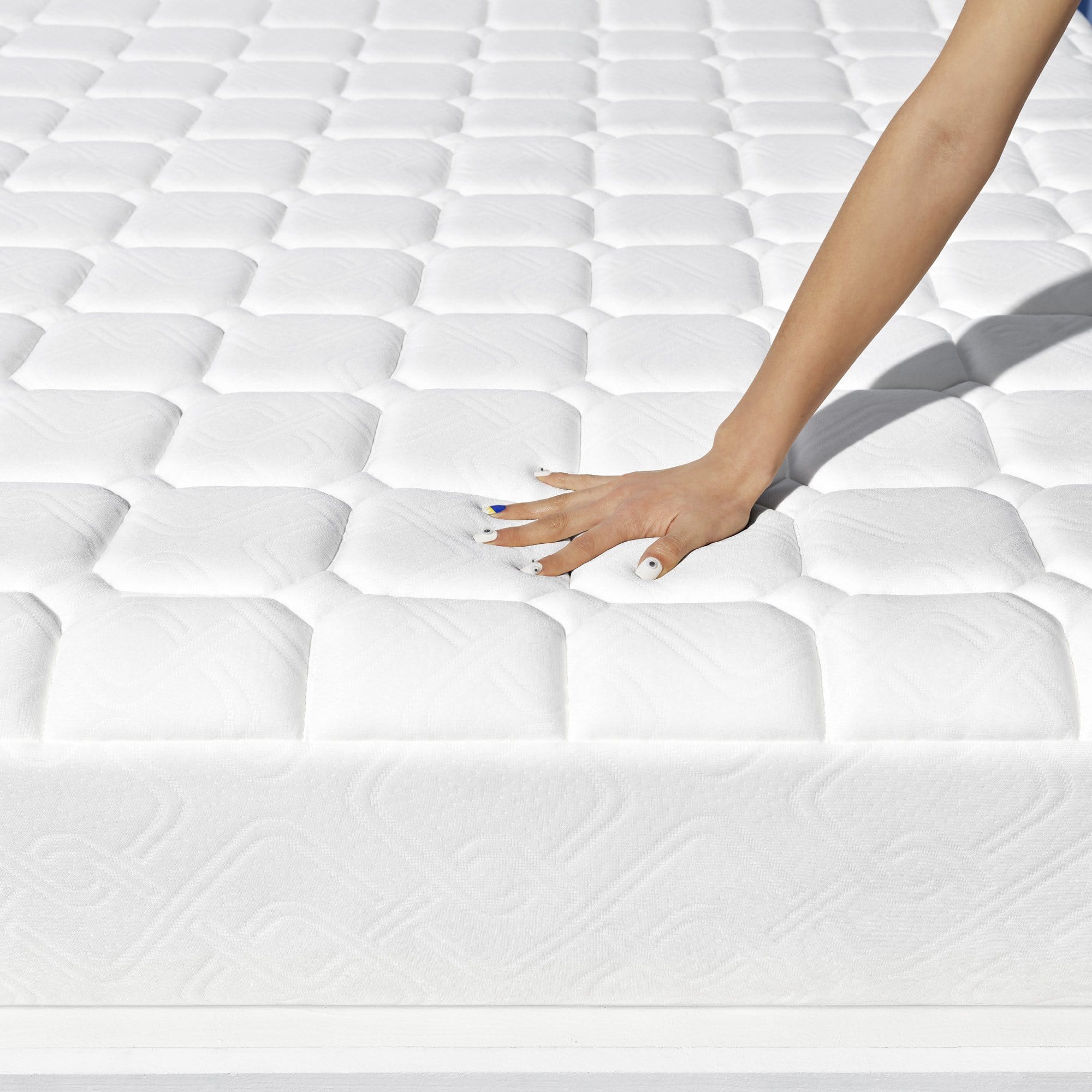 Hybrid - hand pressing on mattress
